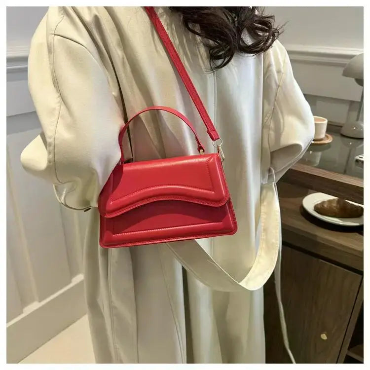 Bolso de mano efecto cuero
