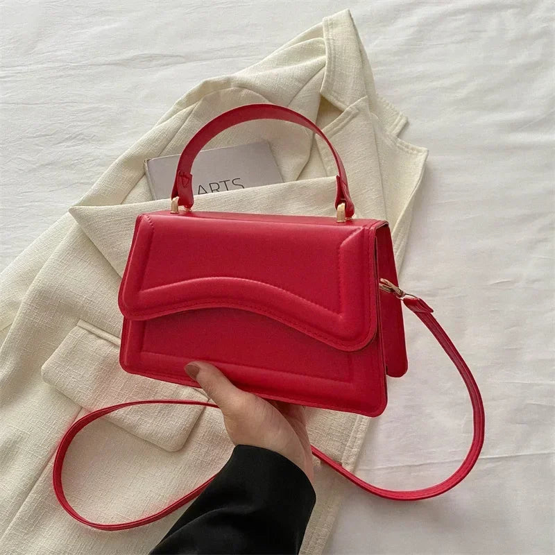 Bolso de mano efecto cuero