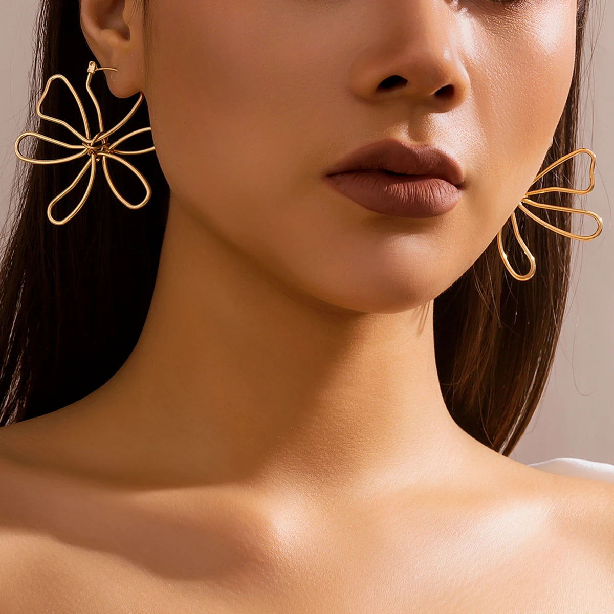 Pendiente flor Woven