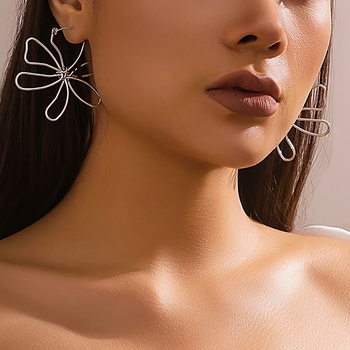 Pendiente flor Woven
