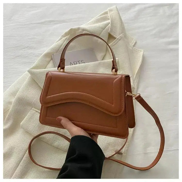 Bolso de mano efecto cuero