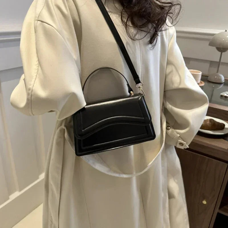 Bolso de mano efecto cuero