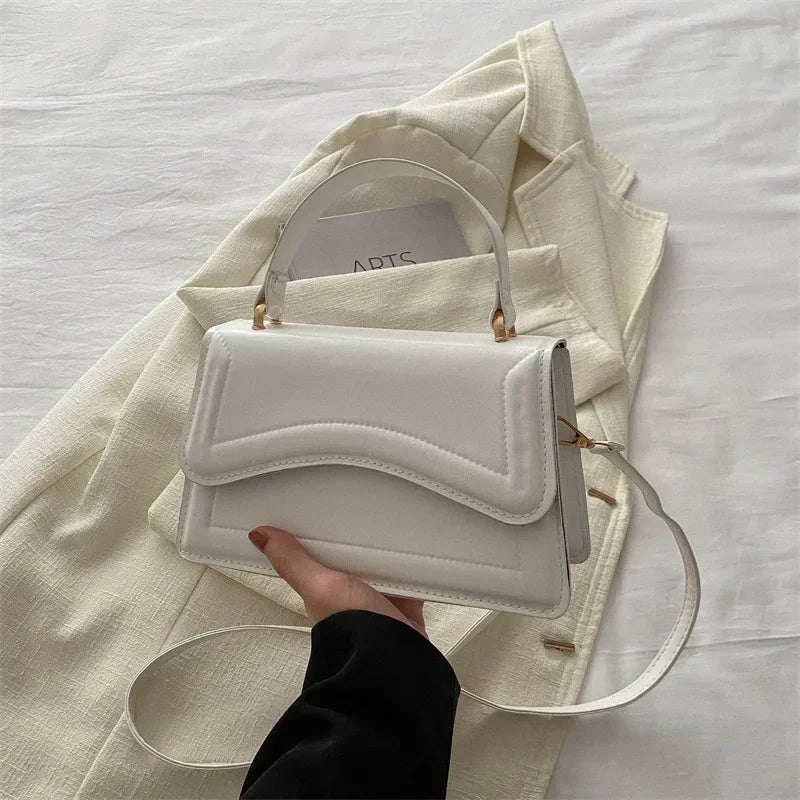 Bolso de mano efecto cuero