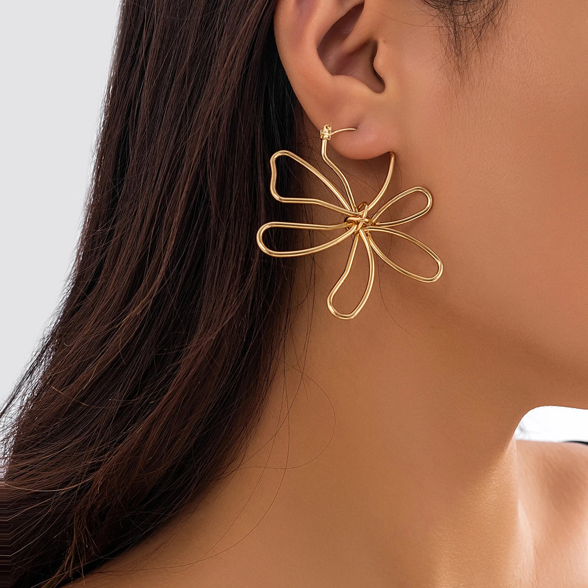 Pendiente flor Woven