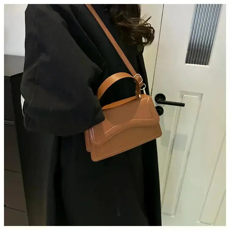 Bolso de mano efecto cuero