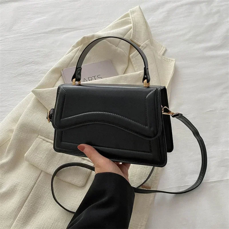 Bolso de mano efecto cuero