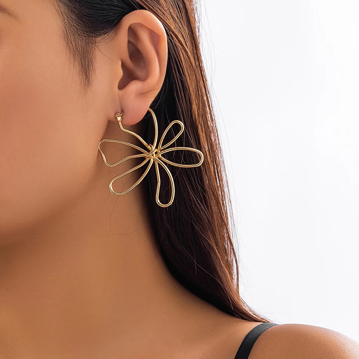 Pendiente flor Woven