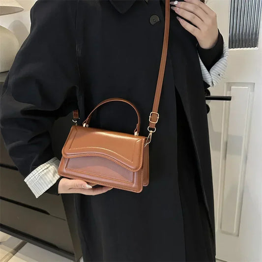 Bolso de mano efecto cuero
